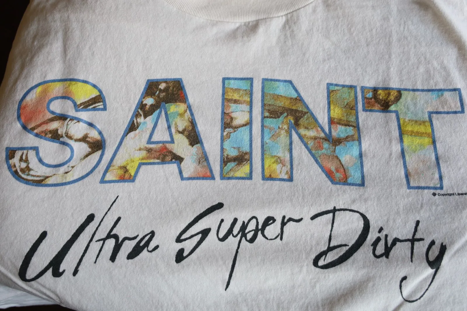 SAINT Mxxxxxx SS TEE/SUPER DIRTY/WHT oil painting SAINT SUPER DIRTY slogan TEE off-white S-XL Made of original OE yarn tube weaving without side seams to distinguish the split fabrics original consistent VINTAGE label/little angel anti-counterfeiting label top printing technology highly restored original details